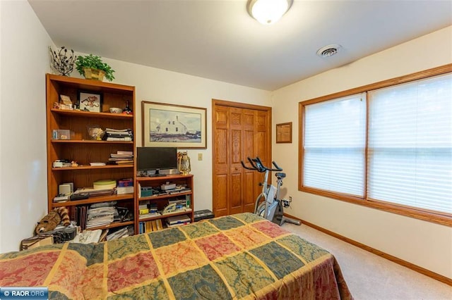 carpeted bedroom featuring a closet