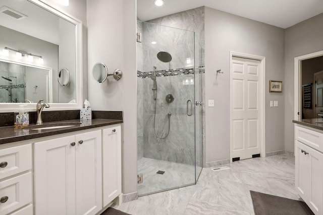 bathroom featuring vanity and walk in shower