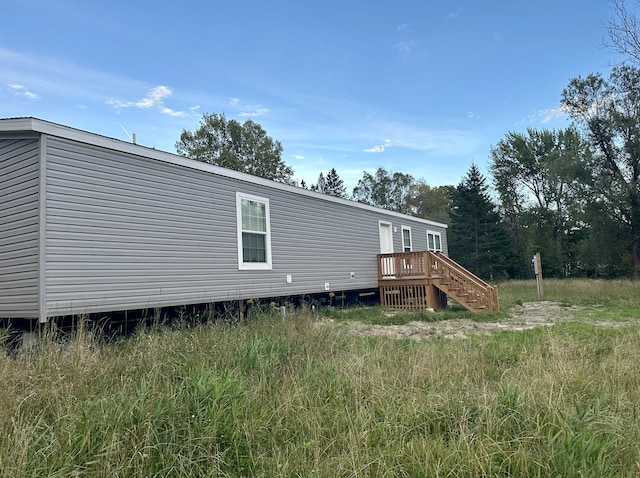 rear view of property with a deck