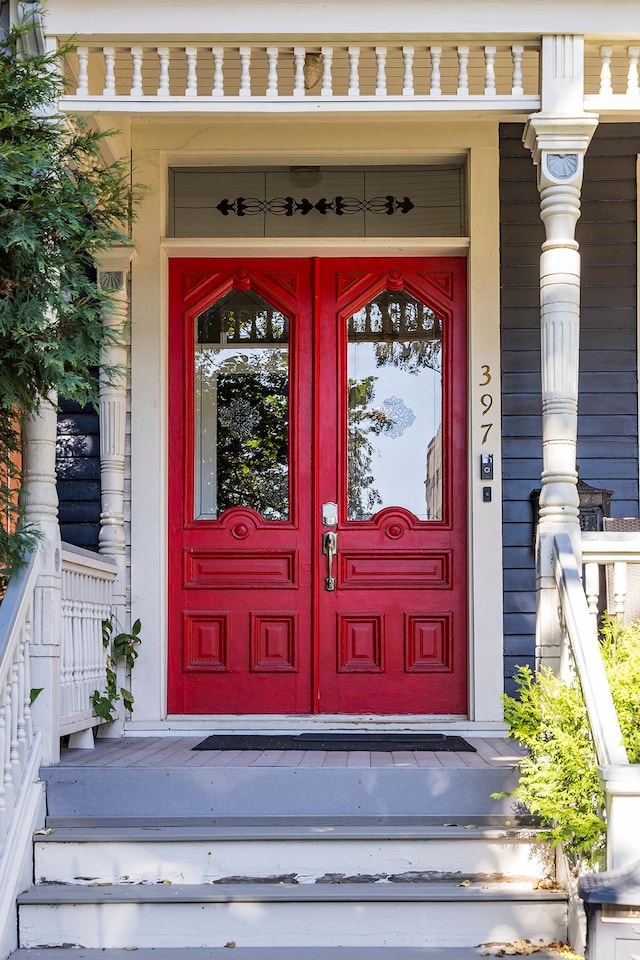 doorway to property featuring a porch