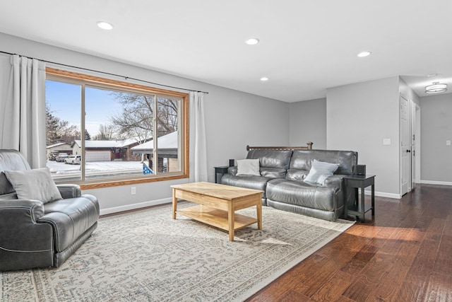 living area with baseboards, dark wood-style flooring, and recessed lighting