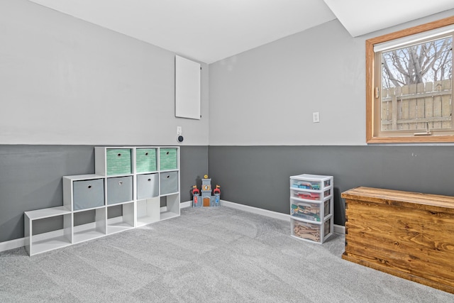 recreation room featuring carpet and baseboards