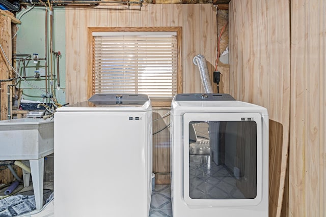 washroom with a sink and separate washer and dryer