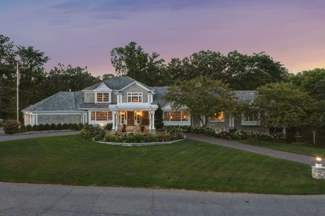 view of front of property with a lawn