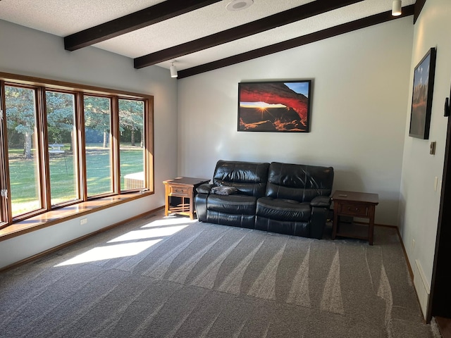 carpeted living room featuring lofted ceiling with beams and a textured ceiling