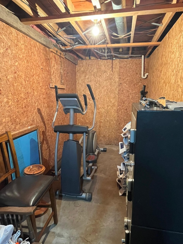 workout room featuring concrete floors