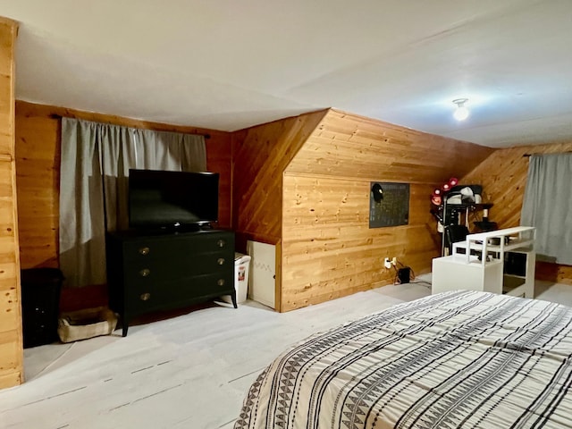 bedroom featuring hardwood / wood-style flooring, lofted ceiling, and wood walls