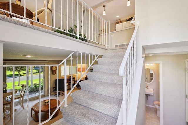 staircase featuring sink