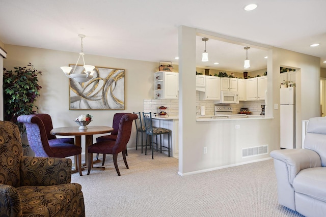 view of carpeted dining space