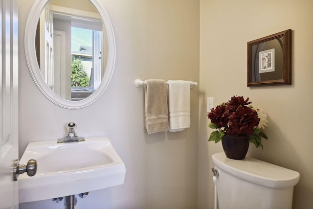 bathroom with toilet and sink