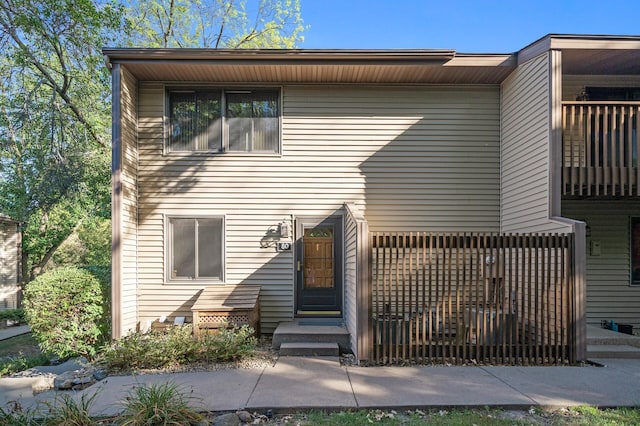 view of front of property with a balcony