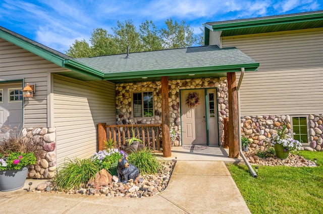 doorway to property featuring covered porch