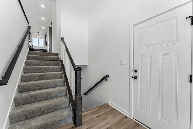 stairway featuring hardwood / wood-style flooring