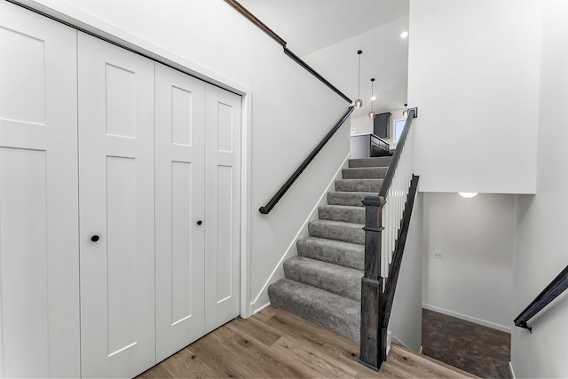 staircase with wood-type flooring