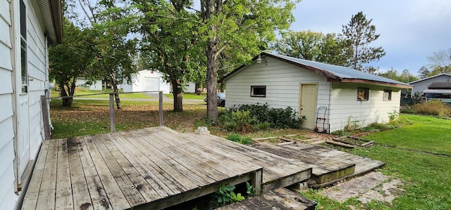 508 5th Ave, Littlefork, MN 56653 - wooden terrace featuring a lawn and an outbuilding