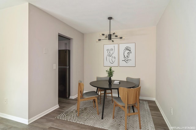 dining space featuring a chandelier and hardwood / wood-style floors