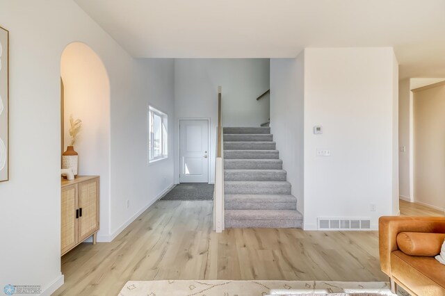 stairway featuring hardwood / wood-style floors