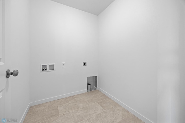 clothes washing area featuring electric dryer hookup, washer hookup, and baseboards