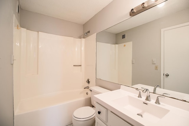 bathroom featuring toilet, vanity, visible vents, and tub / shower combination
