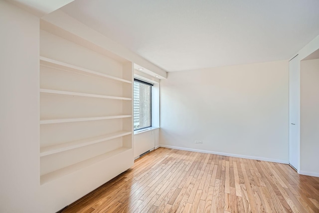 unfurnished room featuring light hardwood / wood-style flooring