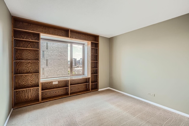 unfurnished room with carpet floors