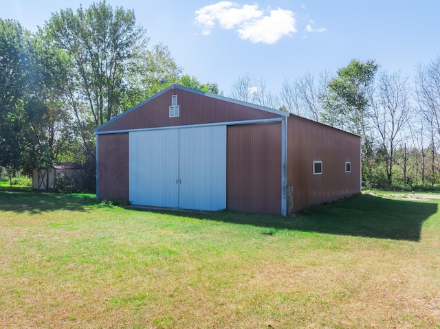 view of outdoor structure with a lawn