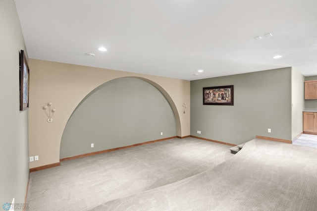 empty room featuring light colored carpet