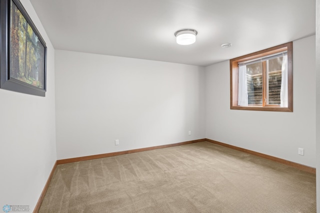 empty room with light colored carpet