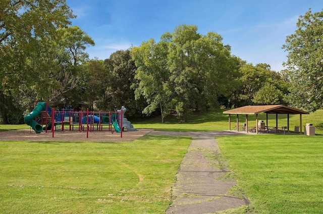 view of jungle gym featuring a lawn