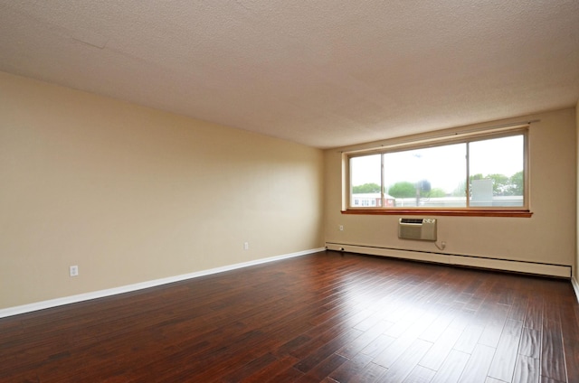 unfurnished room featuring a baseboard heating unit, a textured ceiling, and dark hardwood / wood-style flooring