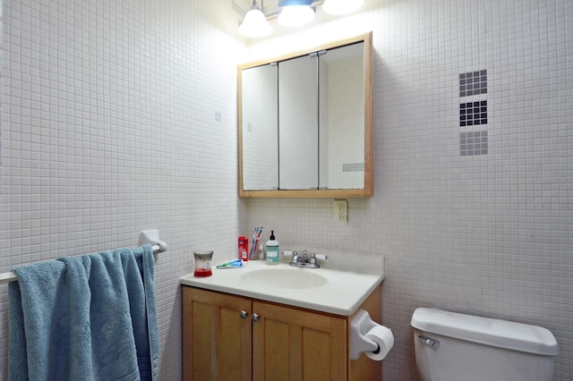 bathroom with vanity and toilet