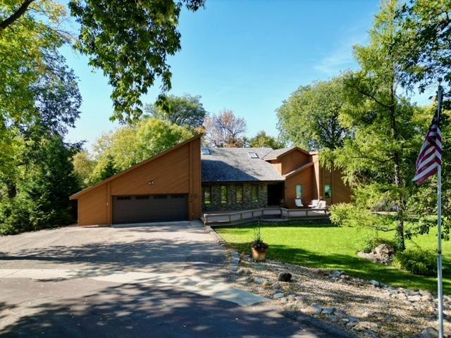 view of front facade with a front lawn and a garage