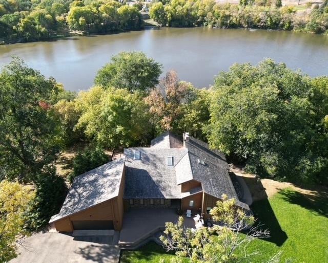 birds eye view of property featuring a water view