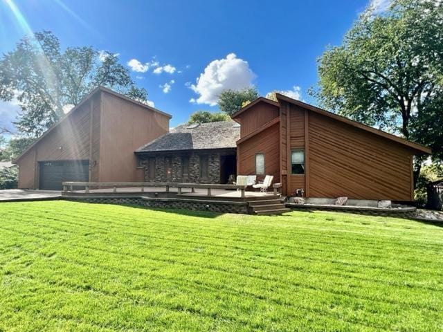 rear view of property with a yard