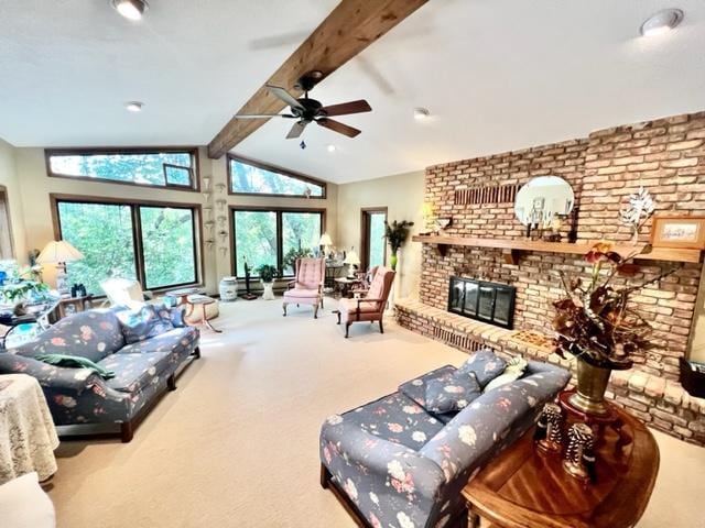 carpeted living room with lofted ceiling with beams, ceiling fan, brick wall, and a fireplace