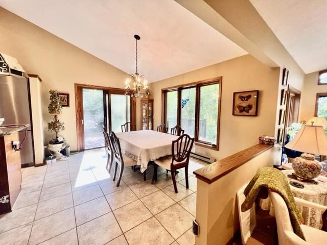 tiled dining space with lofted ceiling, baseboard heating, and a chandelier