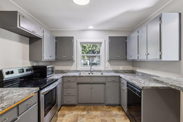 kitchen featuring gray cabinetry and stainless steel appliances