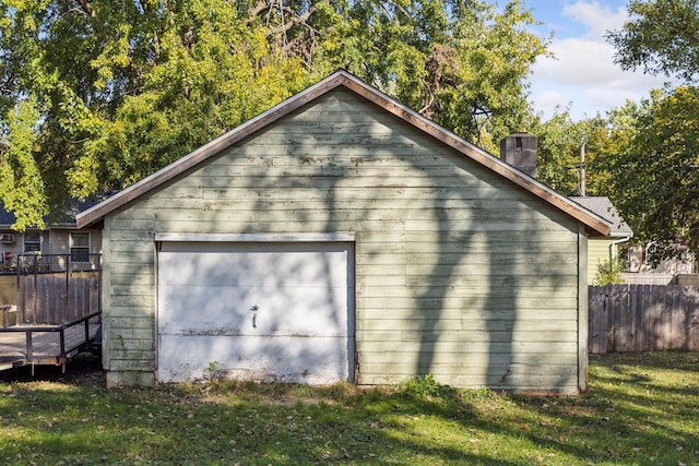 exterior space featuring wood walls and a yard