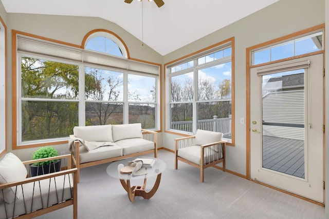 sunroom / solarium with ceiling fan and vaulted ceiling