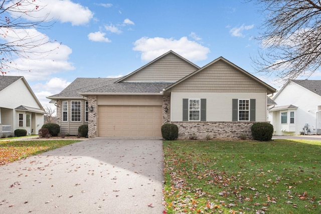 view of front of home with a garage and a front yard