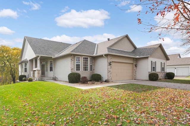 view of front of house featuring a front lawn and a garage