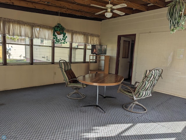 interior space featuring beam ceiling and ceiling fan