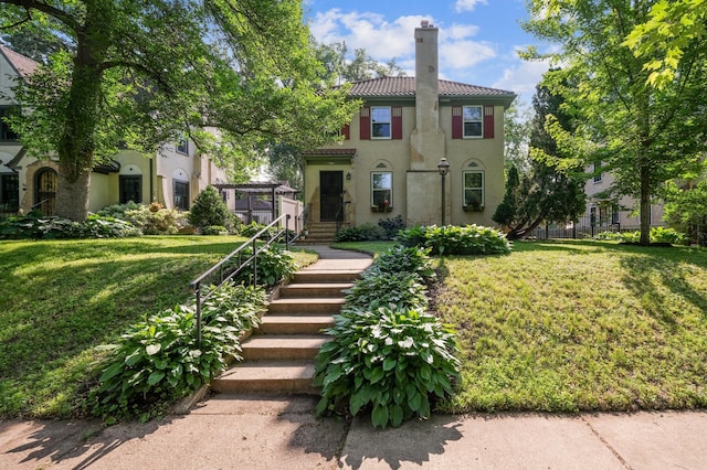 4837 11th Ave S, Minneapolis, MN 55417 - view of front facade with a chimney, stucco siding, and a front yard