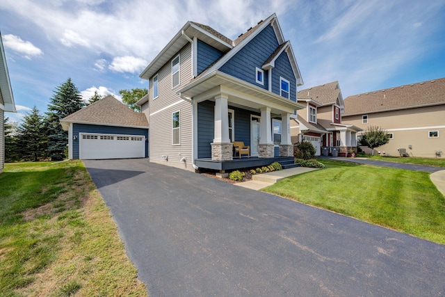 craftsman-style house featuring covered porch, a front lawn, and a garage