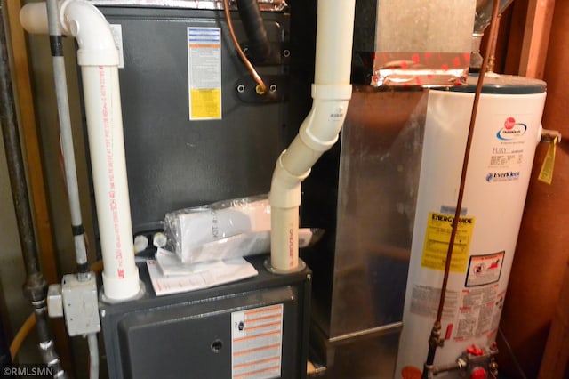 utility room with gas water heater and heating unit