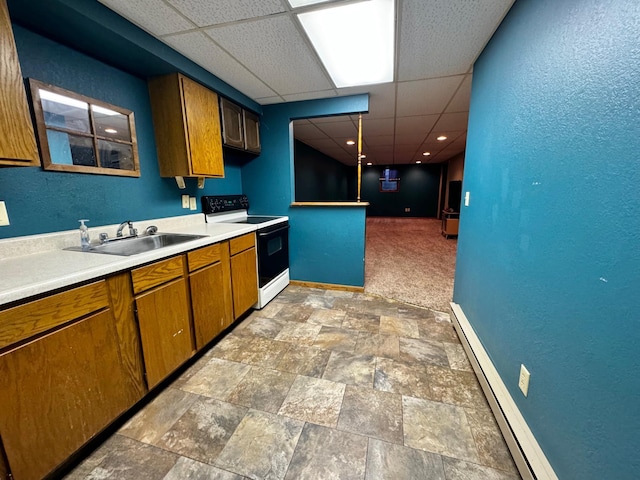 kitchen featuring sink, white electric range, a baseboard heating unit, carpet floors, and a paneled ceiling