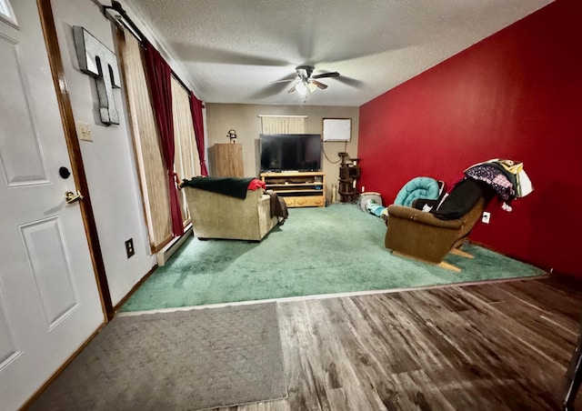 unfurnished living room featuring wood-type flooring, a textured ceiling, and ceiling fan