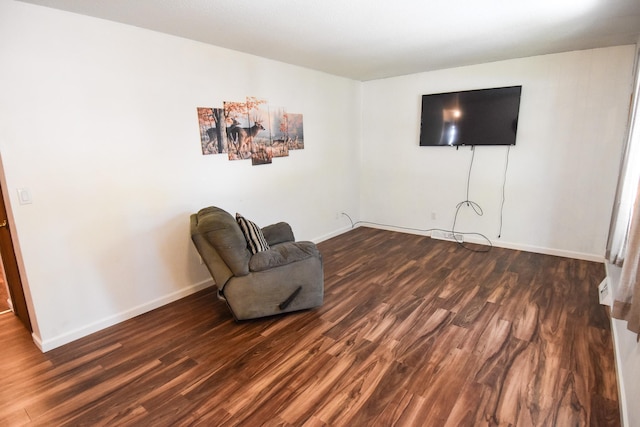 sitting room with dark hardwood / wood-style floors