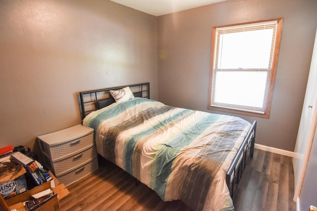 bedroom featuring dark hardwood / wood-style floors