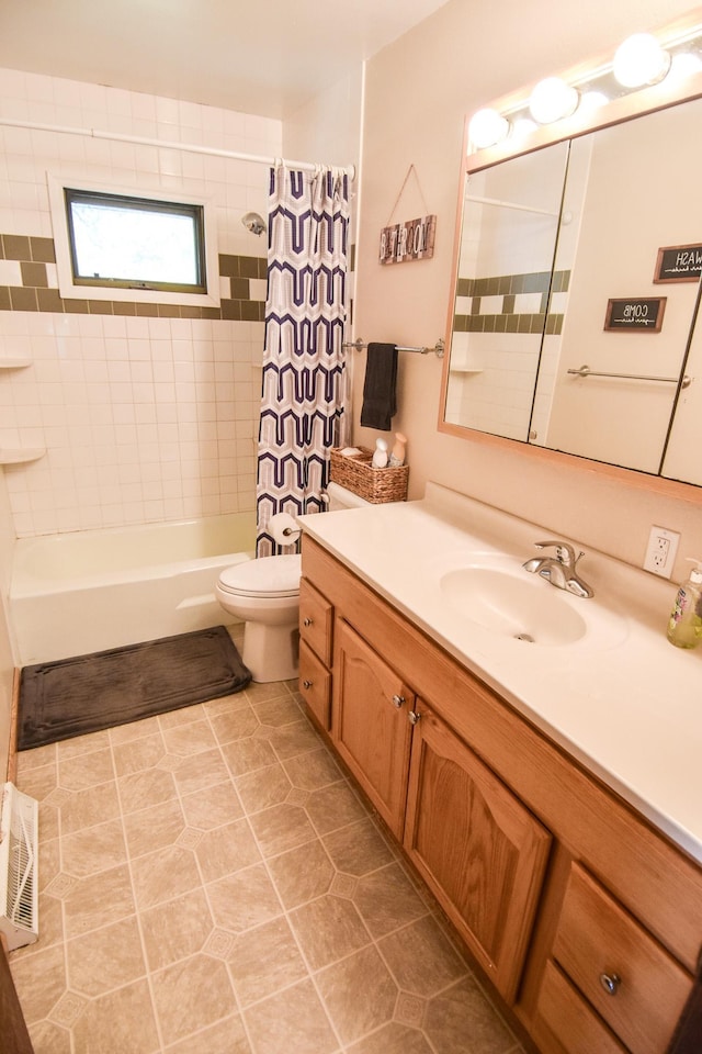 full bathroom featuring shower / tub combo with curtain, vanity, toilet, and tile patterned floors